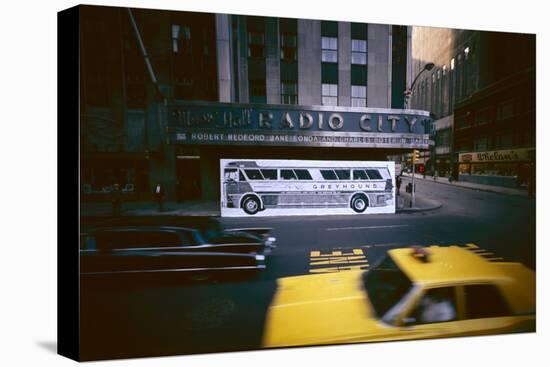 Poster of a Greyhound Bus in Front of Radio City Music Hall, New York, New York, Summer 1967-Yale Joel-Stretched Canvas