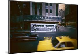 Poster of a Greyhound Bus in Front of Radio City Music Hall, New York, New York, Summer 1967-Yale Joel-Mounted Photographic Print