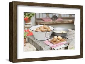 Potatoes, Partly Peeled, on Table in Front of Farmhouse-Eising Studio - Food Photo and Video-Framed Photographic Print
