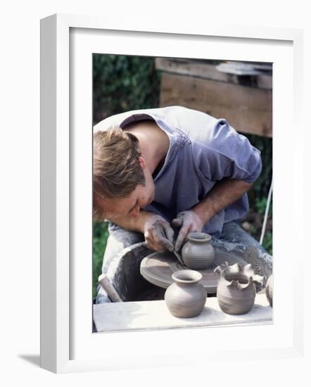 Potter at Work on Wheel at Rustic Fayre, Devon, England, United Kingdom-Ian Griffiths-Framed Photographic Print