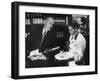 Pouring Champagne from a Huge Tilted Toward Glass Held on Tray by Waiter, at the Hotel Hilton-Ralph Crane-Framed Photographic Print