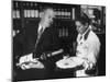 Pouring Champagne from a Huge Tilted Toward Glass Held on Tray by Waiter, at the Hotel Hilton-Ralph Crane-Mounted Photographic Print