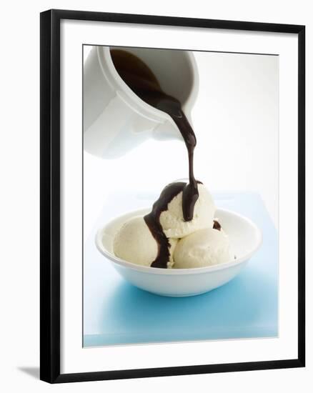 Pouring Chocolate Sauce over Vanilla Ice Cream-null-Framed Photographic Print