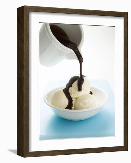 Pouring Chocolate Sauce over Vanilla Ice Cream-null-Framed Photographic Print