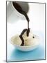 Pouring Chocolate Sauce over Vanilla Ice Cream-null-Mounted Photographic Print