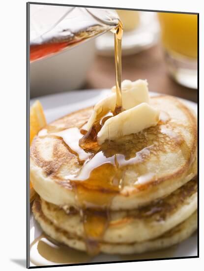 Pouring Maple Syrup over Pancakes with Dab of Butter-null-Mounted Photographic Print