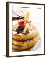 Pouring Maple Syrup over Waffles with Butter and Berries-null-Framed Photographic Print