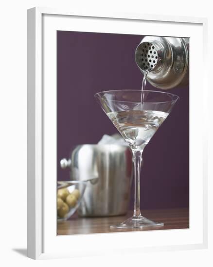 Pouring Martini Out of Cocktail Shaker into Glass-null-Framed Photographic Print
