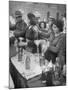 Pouring Olive Oil in Buyers' Bottles in Black Market-Alfred Eisenstaedt-Mounted Photographic Print
