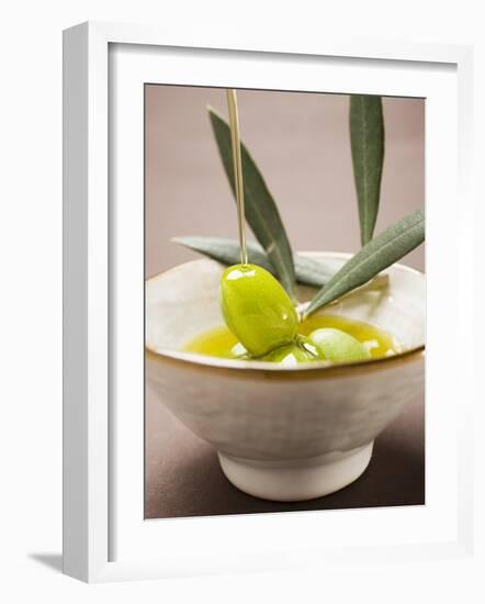 Pouring Olive Oil Over Olive Sprig with Green Olives-null-Framed Photographic Print