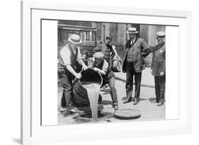 Pouring Out Illegal Alcohol into a Sewer-null-Framed Premium Giclee Print