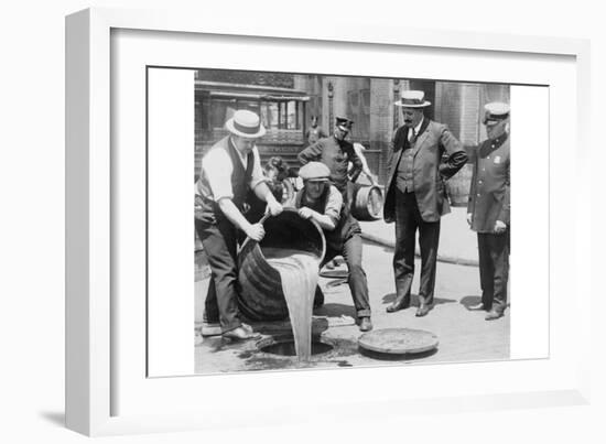 Pouring Out Illegal Alcohol into a Sewer-null-Framed Art Print