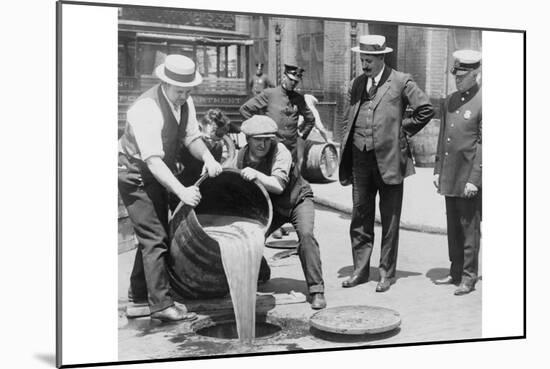 Pouring Out Illegal Alcohol into a Sewer-null-Mounted Art Print