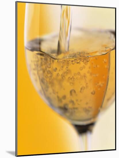 Pouring Prosecco into a Glass-Alexander Feig-Mounted Photographic Print