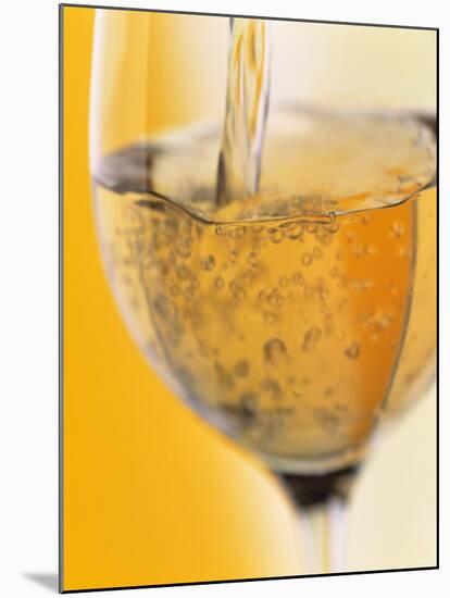 Pouring Prosecco into a Glass-Alexander Feig-Mounted Photographic Print