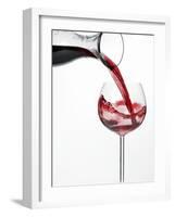 Pouring Red Wine into Glass from Carafe-Kröger & Gross-Framed Photographic Print