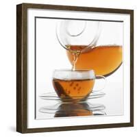 Pouring Tea into a Glass Cup-Alexander Feig-Framed Photographic Print