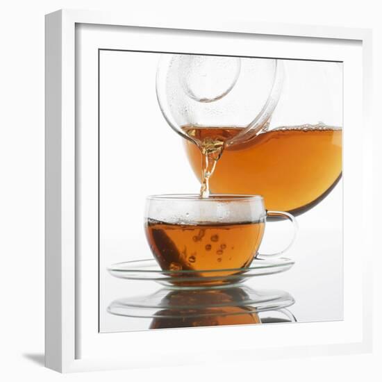 Pouring Tea into a Glass Cup-Alexander Feig-Framed Photographic Print