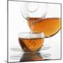 Pouring Tea into a Glass Cup-Alexander Feig-Mounted Photographic Print