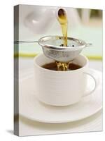 Pouring Tea Through a Tea Strainer-Winfried Heinze-Stretched Canvas