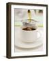 Pouring Tea Through a Tea Strainer-Winfried Heinze-Framed Photographic Print