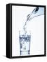 Pouring Water from a Bottle into a Glass-Petr Gross-Framed Stretched Canvas