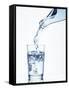 Pouring Water from a Bottle into a Glass-Petr Gross-Framed Stretched Canvas