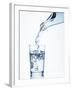 Pouring Water from a Bottle into a Glass-Petr Gross-Framed Photographic Print