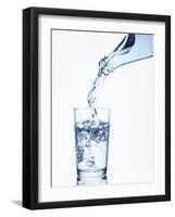 Pouring Water from a Bottle into a Glass-Petr Gross-Framed Photographic Print