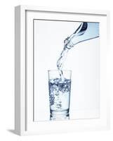 Pouring Water from a Bottle into a Glass-Petr Gross-Framed Photographic Print