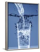 Pouring Water from a Bottle into a Glass-Petr Gross-Framed Photographic Print