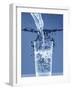 Pouring Water from a Bottle into a Glass-Petr Gross-Framed Photographic Print