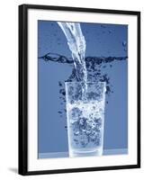 Pouring Water from a Bottle into a Glass-Petr Gross-Framed Photographic Print