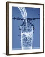 Pouring Water from a Bottle into a Glass-Petr Gross-Framed Photographic Print