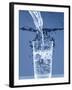 Pouring Water from a Bottle into a Glass-Petr Gross-Framed Photographic Print