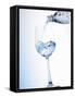 Pouring Water into a Glass-Klaus Arras-Framed Stretched Canvas