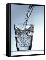 Pouring Water into a Glass-Bodo A^ Schieren-Framed Stretched Canvas