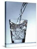 Pouring Water into a Glass-Bodo A^ Schieren-Stretched Canvas