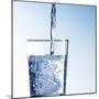 Pouring Water into a Glass-Kai Schwabe-Mounted Photographic Print