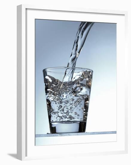 Pouring Water into a Glass-Bodo A^ Schieren-Framed Photographic Print