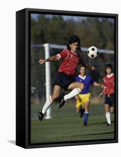 Powerful Leaping Soccer Player-null-Framed Stretched Canvas