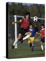 Powerful Leaping Soccer Player-null-Stretched Canvas