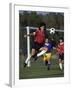 Powerful Leaping Soccer Player-null-Framed Premium Photographic Print