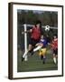 Powerful Leaping Soccer Player-null-Framed Premium Photographic Print