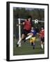 Powerful Leaping Soccer Player-null-Framed Premium Photographic Print