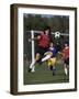 Powerful Leaping Soccer Player-null-Framed Photographic Print