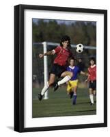 Powerful Leaping Soccer Player-null-Framed Photographic Print