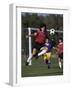 Powerful Leaping Soccer Player-null-Framed Photographic Print