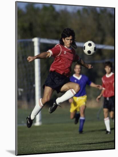 Powerful Leaping Soccer Player-null-Mounted Photographic Print