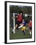 Powerful Leaping Soccer Player-null-Framed Photographic Print